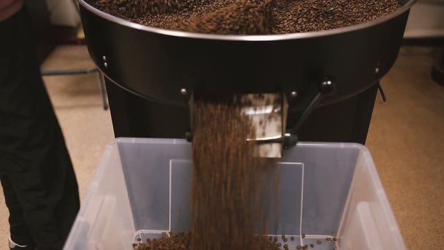 Coffee Beans After Roasting Pour Into Containers. Close-up