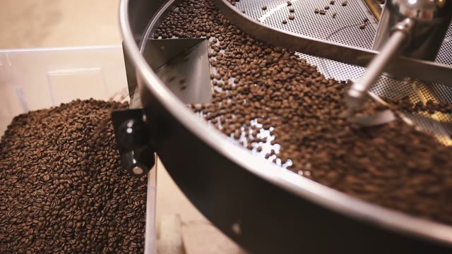 Pour Coffee Beans After Roasting. Close-up