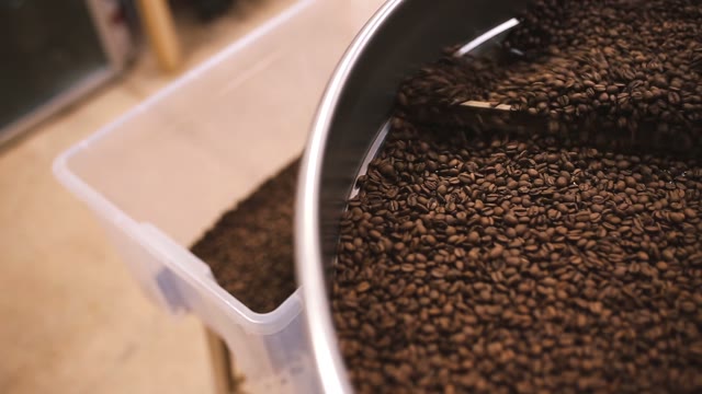 Pour Coffee Beans After Roasting. Close-up