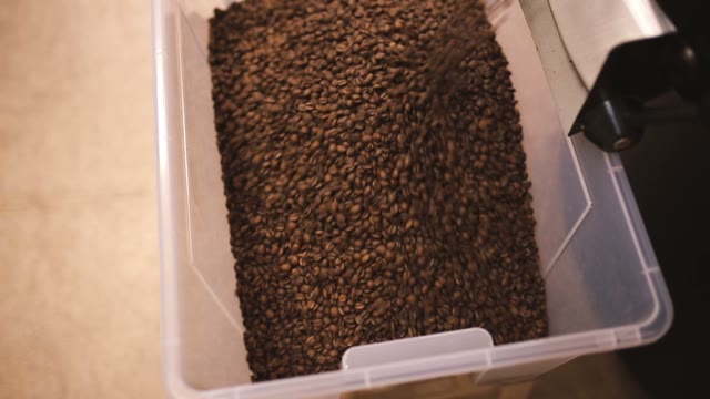 Coffee Beans After Roasting Pour Into A Container. Close-up