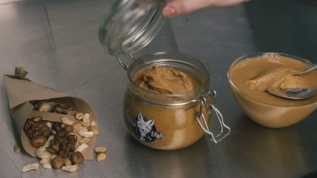 Honey In A Jar, Nuts In Bags. Close-up. Slow Motion
