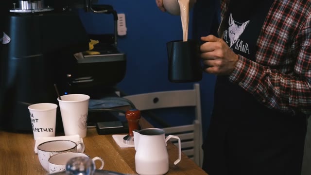 Barista Surging Milk. Close-up. Slow Motion