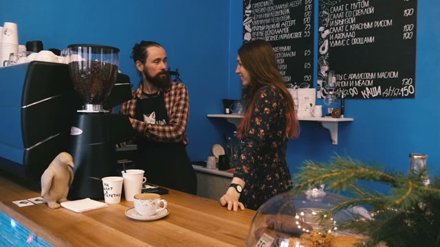 Barista Kissing A Girl At The Bar. Slow Motion