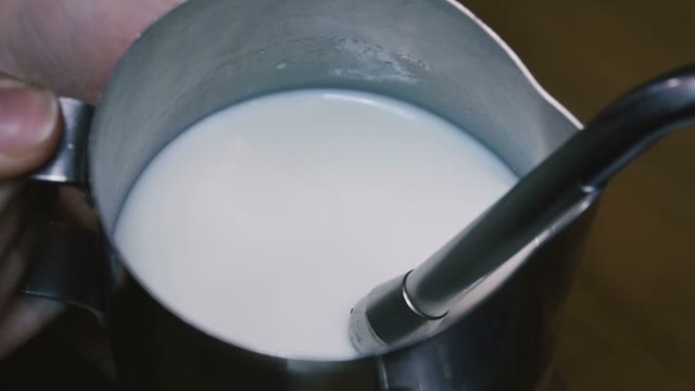 Cream In The Iron Circle. Slow Motion. Close-up