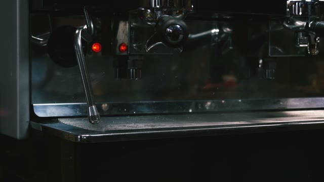 Coffee Machine. Emits Smoke. Close-up