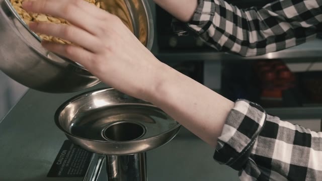 Nuts Poured Into The Mixer. Close-up