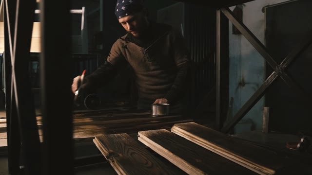 Man Paints The Board. Close-up