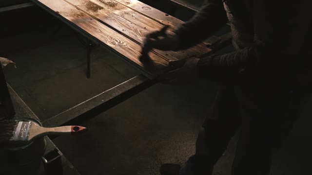 Carpenter Cleans Wooden Boards. Close-up