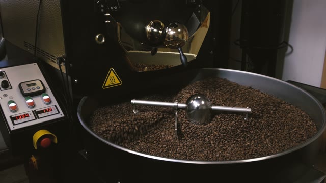 Freshly Roasted Coffee Beans Mixing In A Coffee Roaster