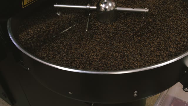 Coffee Beans After Roasting Mixing. Close-up