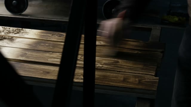 Carpenter Shakes Off Dust. Close-up