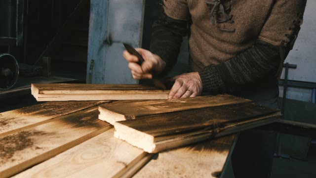Carpenter Cleans Wooden Boards. Close-up