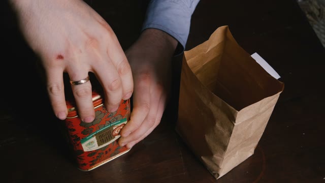 Pour The Tea Leaves In A Paper Bag. Close-up