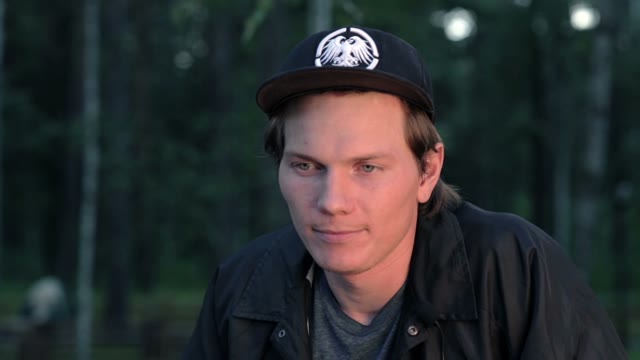 Young Man Talking To Camera As If Being Interviewed