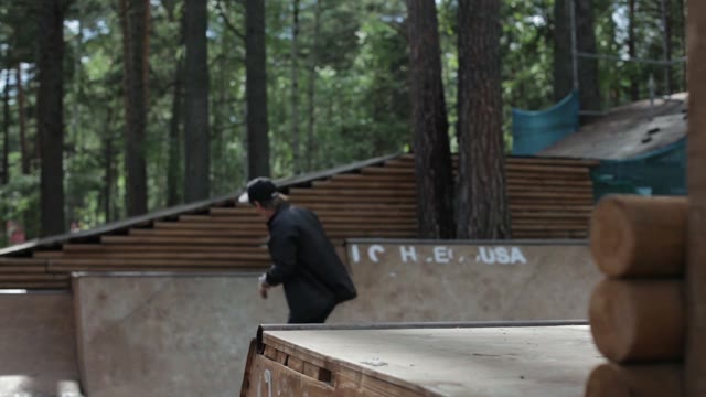 Guy Doing A Trick On A Skateboard On The Ramp