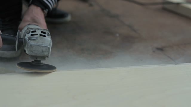 Carpender Grinds Wood Close-up
