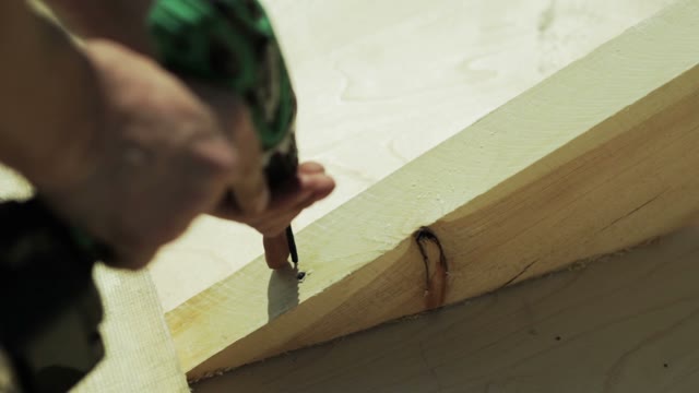 Carpenter Spins Screw Screwdriver