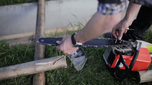 Man Getting Ready To Work With A Chainsaw