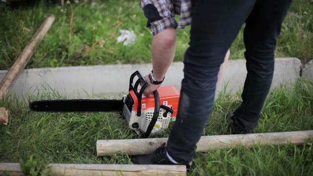 Man Prepared A Chainsaw To Work