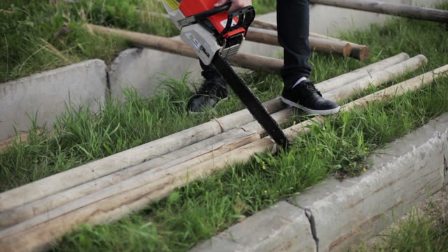 Carpenter Sawing Timber Chainsaw