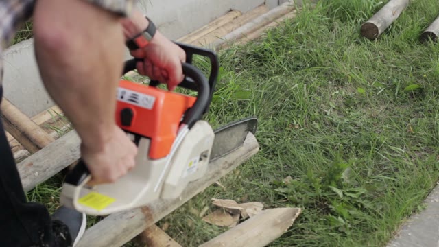 Man Makes The Stakes Of Logs Chainsaw