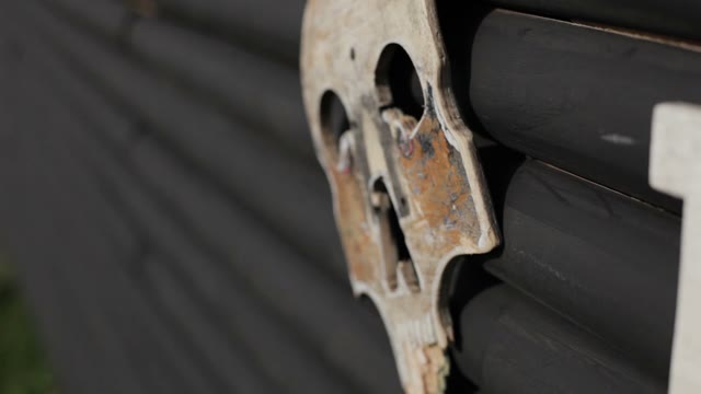 Wooden Skull It Is Hanging On A Fence Close-up