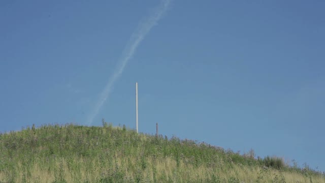 Pole On A Hill Against The Sky