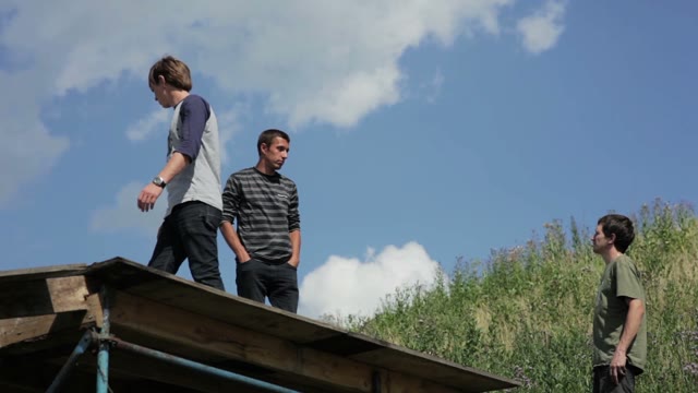 Men Discussing Something In Motion