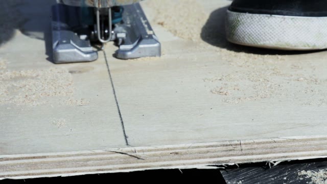 Man Sawed Plywood Close-up