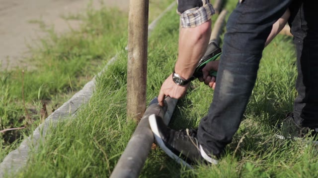 Man Twists The Screws
