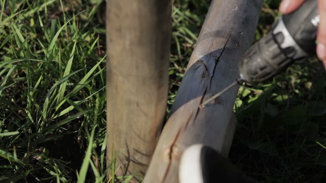 Man Twists The Screws Close-up