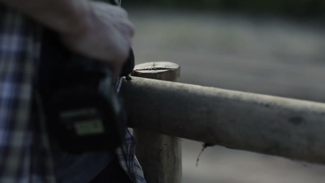Man Uses A Screwdriver Close-up