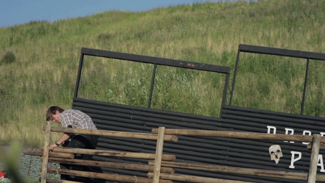 Man Spins Screws On The Fence