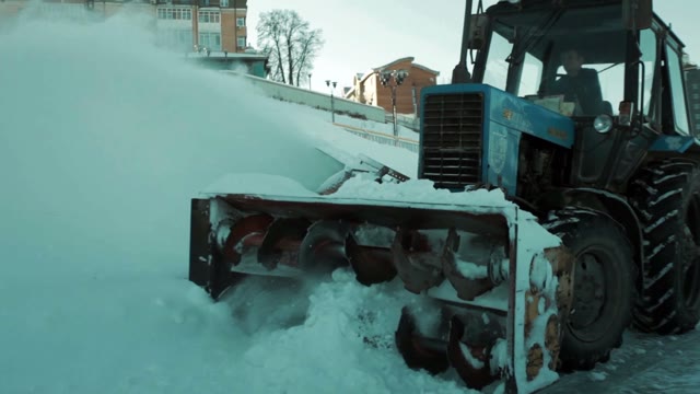 Snowplow Removes A Lot Of Snow. Close-up