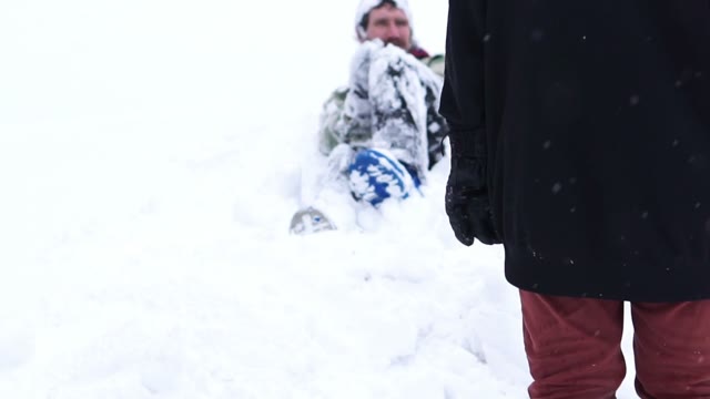 Man Lying In The Snow