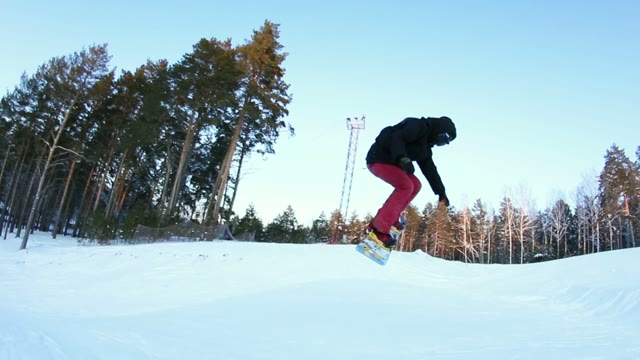 Snowboarder Doing A Stunt In The Park
