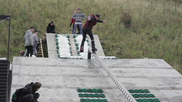 The Guy Makes A Trick On A Snowboard