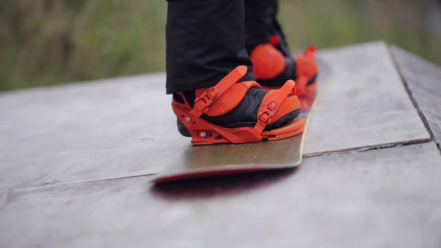 Snowboarder Tying Shoelaces. Close-up