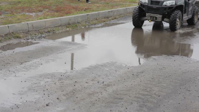 Quad Bike Rides Through The Puddles