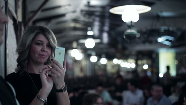 Beautiful Woman Takes A Smartphone