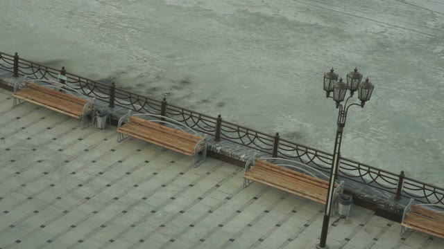 Man Does A Trick On A Skateboard On The Waterfront