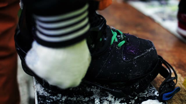 Snowboarder Buttons Fastening Close Up