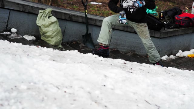 Snowboarder Warming Up Before Skiing