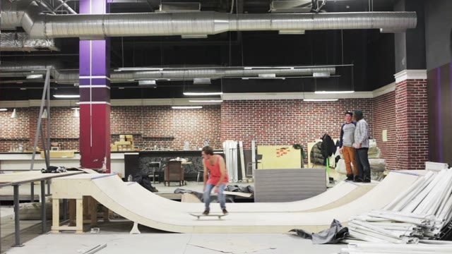 Skateboarder Doing A Trick On A Ramp