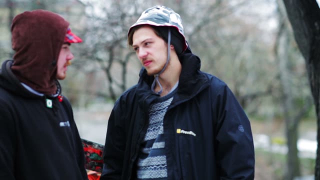 Two Men Talking In The Outdoor