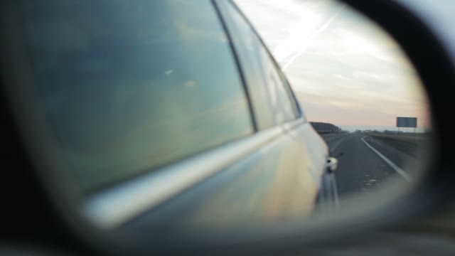 View Of The Highway With The Side Mirror Of A Vehicle