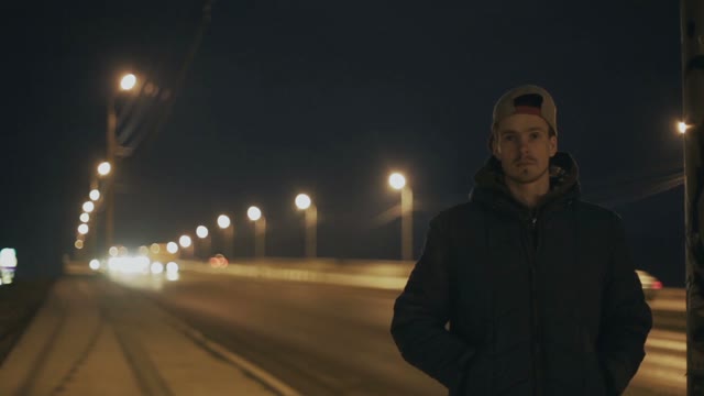 Man Stands On The Background Of The Road