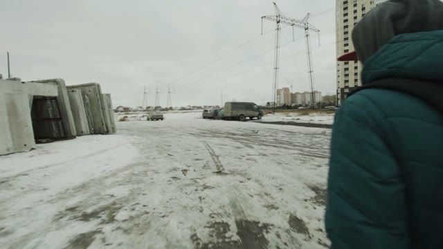Man Goes Beside Concrete Slabs