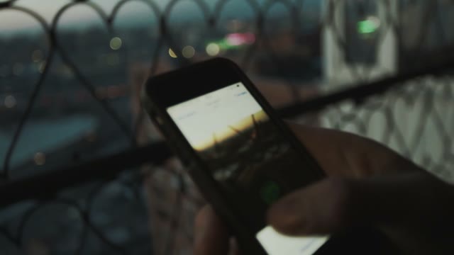 Man Flips Through Photos Close-up