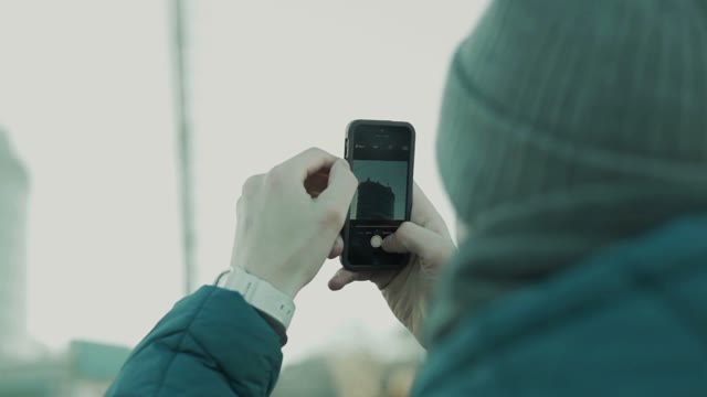 Man Takes Pictures Building On The Smartphone